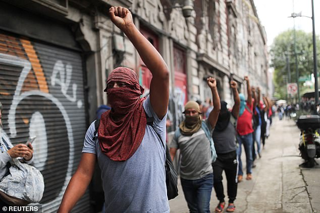 Students march through the streets of Mexico City near the Ministry of the Interior asking the administration of President Andrés Manuel López Obrador to respond for the disappearance of 43 normalistas