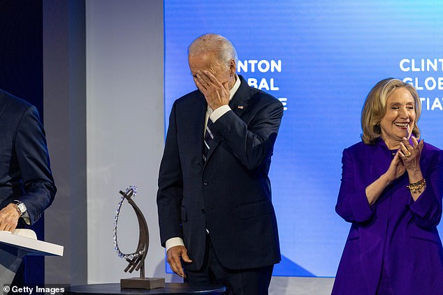 President Joe Biden wipes away a tear as Bill Clinton praises him