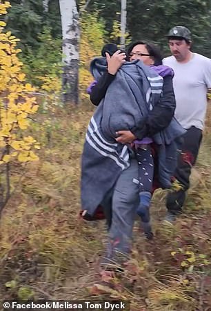 The girl's mother picked her up and carried her to safety.