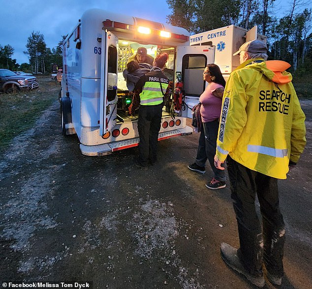 Volunteers cheered as the girl was taken to safety Sunday night.