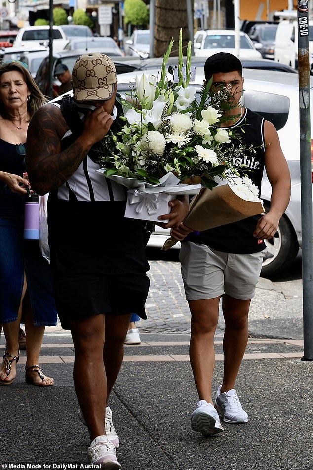 The heartbroken loved ones of a young man stabbed outside a popular Mexican restaurant returned to the scene of the shocking crime to leave flowers and pay their respects.