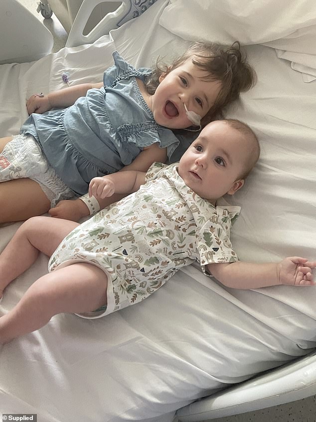 Bella's parents realised something was wrong when they saw her limping, but she quickly lost the strength to lift her arms, walk or swallow over the next two weeks (pictured, left)