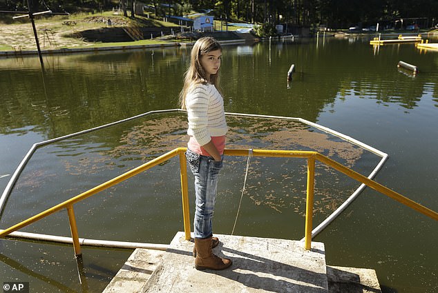 Ms Hardig is pictured above after recovering from the infection at Willow Springs Water Park, where she says she contracted the amoeba.