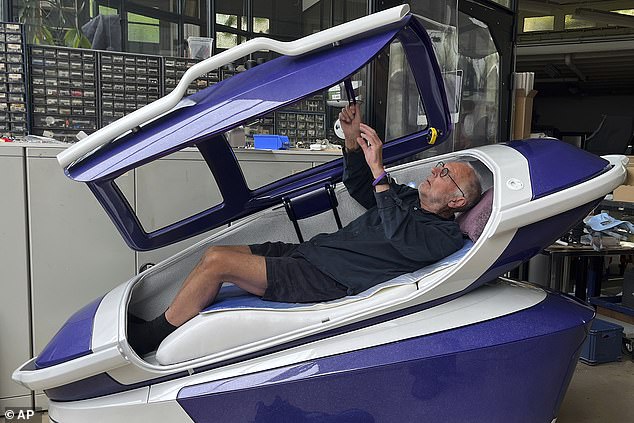 Philip Nitschke lies in a 'suicide capsule' known as 'The Sarco' in Rotterdam, Netherlands, on July 8, 2024