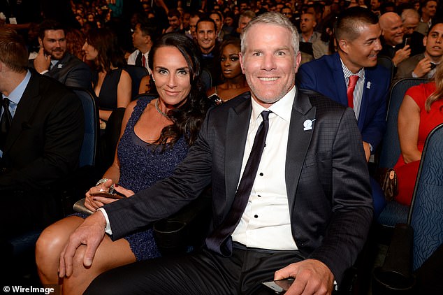 Favre sits next to his wife Deanna at the 2015 ESPY Awards in Los Angeles, California.