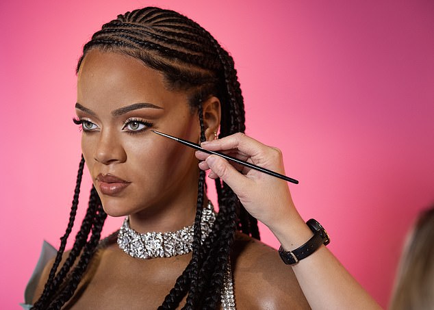 Her look is completed by her signature Fulani braids and dazzling jewelry, including her sparkling diamond choker.