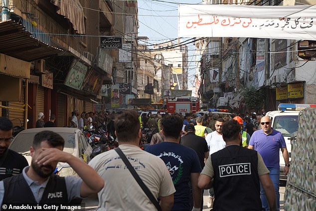 Security forces and medical teams arrive at the scene after the Israeli army attacked the 4th and 5th floors of a building in the Ghobeiry municipality, where Hezbollah is strong in Dahiyeh, a southern suburb of Beirut, Lebanon.