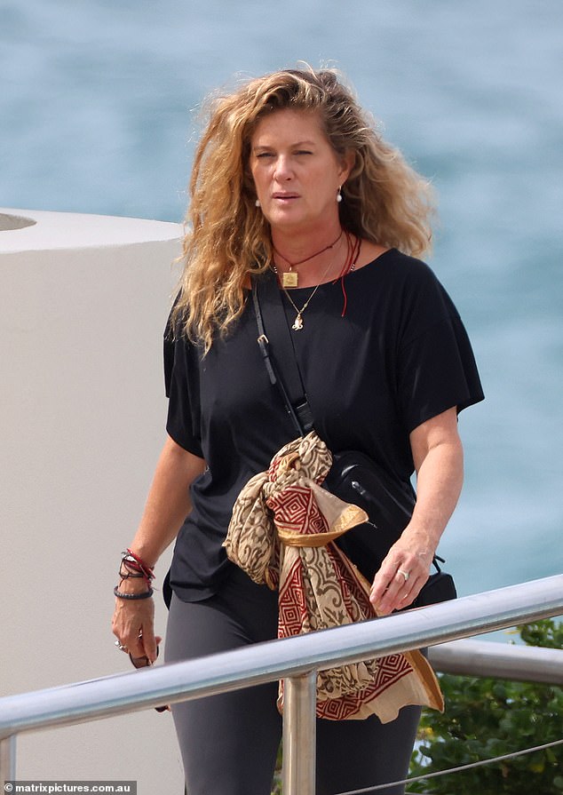 The New Zealand model and actress looked much younger than her 55 years as she walked along the coast in grey leggings and a black top.