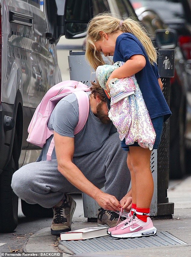 At one point, the Maestro star bent down to tie the lace on seven-year-old Lea's pink Nike sneaker.