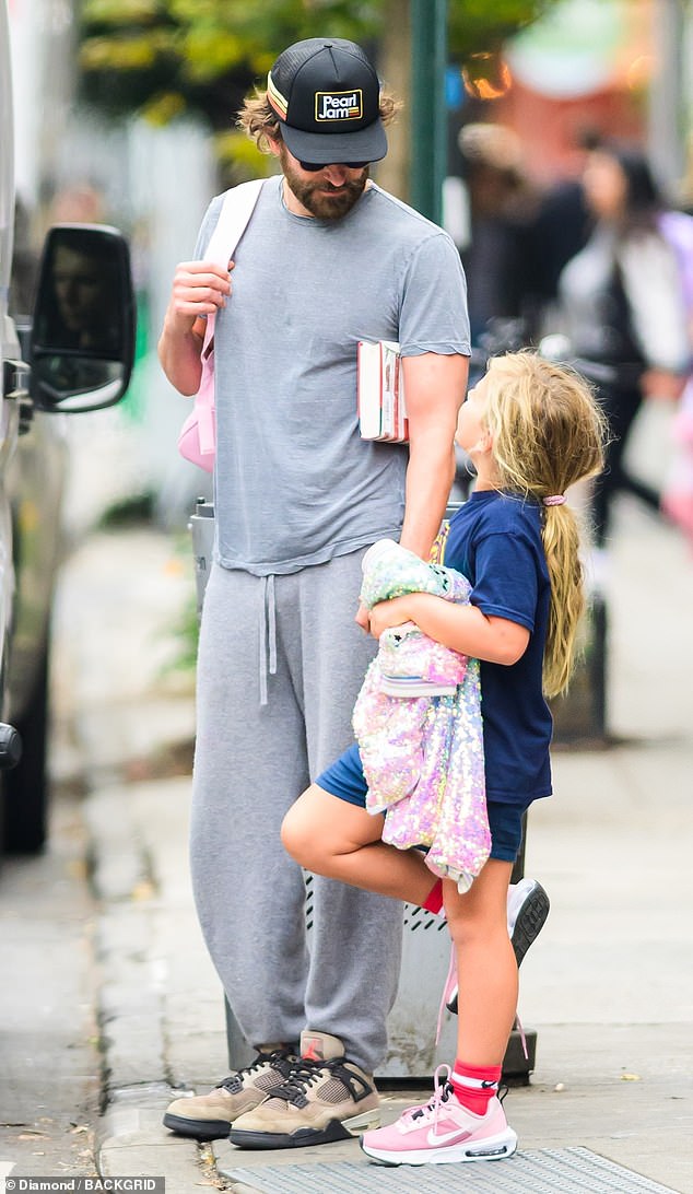 Cooper was dressed comfortably in a simple grey T-shirt and matching sweatpants.