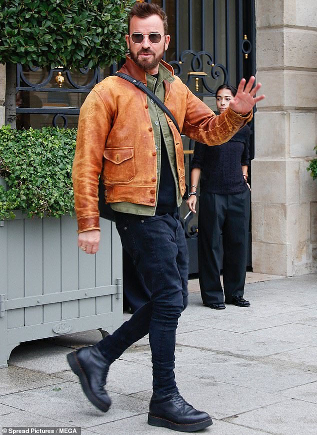 Justin, who was previously married to actress Jennifer Aniston, paired the outfit with a tan leather jacket which he left unbuttoned in the front.