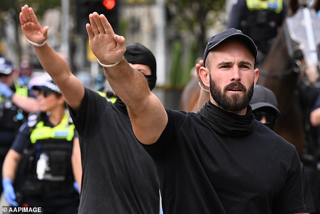 Neo-Nazi leader Thomas Sewell is seen as supporters of Nazi and transgender rights clash at a rally in Melbourne, Saturday, March 18, 2023.