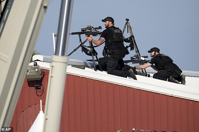 Police snipers return fire after shots were fired as Republican presidential candidate former President Donald Trump spoke at a campaign event in Butler, Pennsylvania, on July 13.