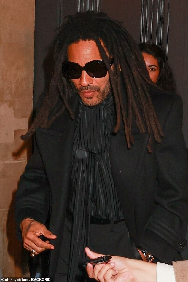 Lenny Kravitz kept a low profile as he was surrounded by autograph hunters.