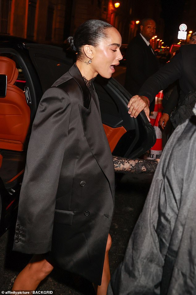 Zoe Kravitz draped a jacket over her shoulders as she arrived at the party with her rocker dad.