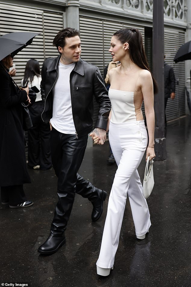 Elsewhere in the show, Brooklyn Beckham, 25, and his wife Nicola Peltz flew in to enjoy the Fashion Week festivities ahead of his mother Victoria Beckham's show on Friday.