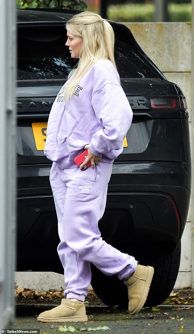 Heading into town on Wednesday morning, Lucy parked and stepped out of her car in a pair of comfortable-looking tan Ugg boots.