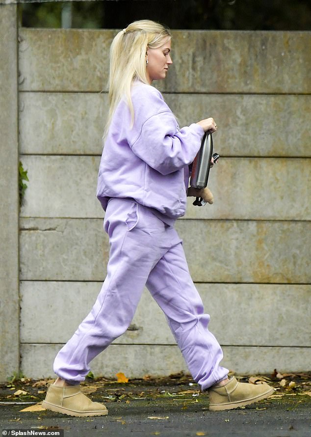 But she covered up her baby bump by sporting a lilac ROTATE Sunday sweatshirt, with a matching pair of sweatpants.