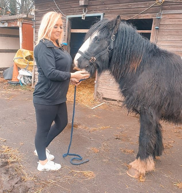 Ms Buchan is pictured with a horse she brought with her benefits. She said she later had to give it away because she could not afford to keep it.