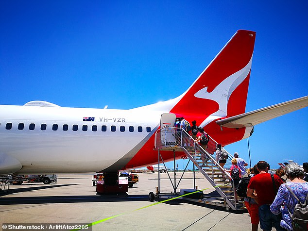 Australians are warned the strike could spread to major cities over the next two weeks (pictured, passengers boarding a flight)