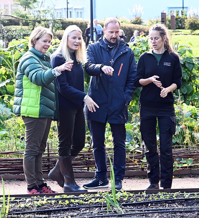 The couple was shown around the farm and looked at the orchards.