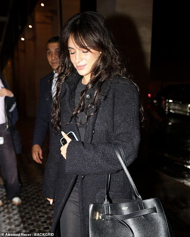 But hours later, the four-time Grammy nominee headed to dinner in Paris with her signature brown hair and bangs.