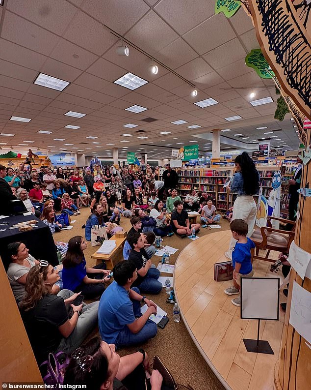 Lauren was photographed giving a speech at a local library while promoting her book.