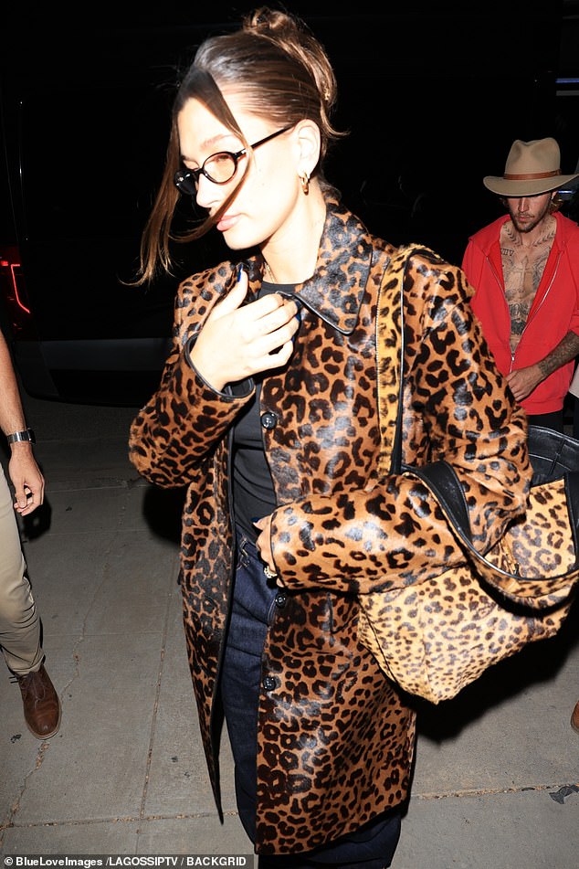 Meanwhile, Hailey sported a cheetah print coat, a matching cheetah bag and red sneakers.