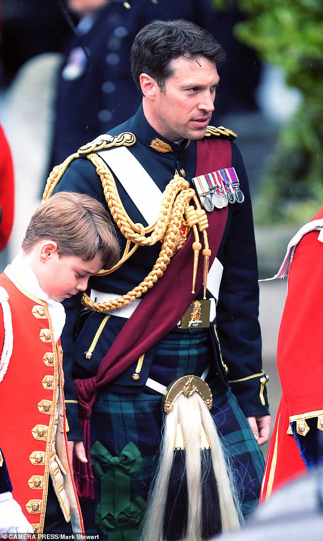 The army officer with Prince George at the king's coronation last year.