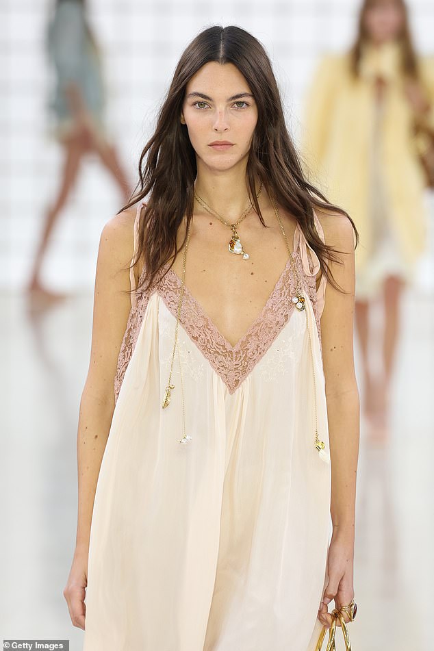 The 26-year-old model turned heads in a sheer cream dress that featured a plunging neckline covered in pink lace.