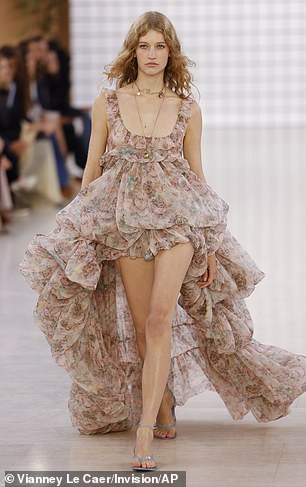 The models took to the catwalk and showed off a stunning floral ruffled dress.