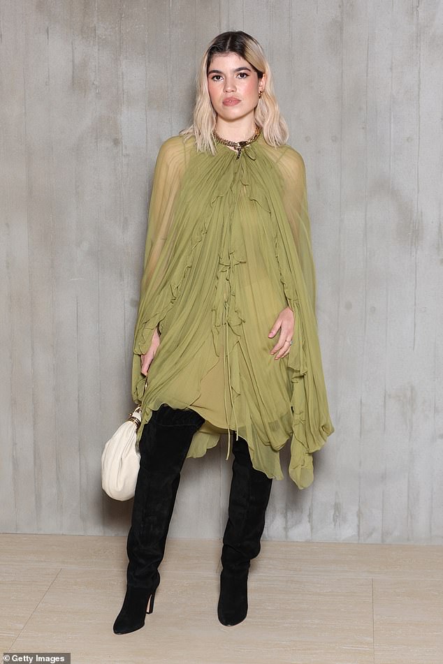 Meanwhile, Liam Gallagher's daughter Molly, 26, looked incredible in a sheer green mesh dress which she teamed with a pair of thigh-high black boots and a white handbag.