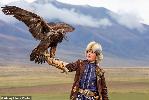 Above, an eagle hunter and his golden eagle in Kyrgyzstan. Matt says: 