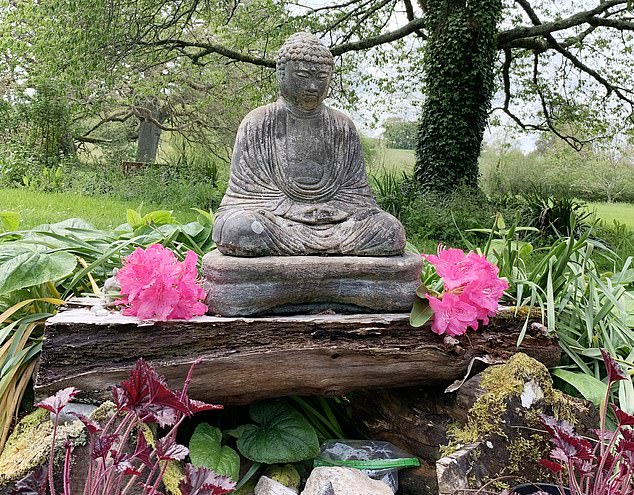 A Buddha statue in the garden of the retreat. 