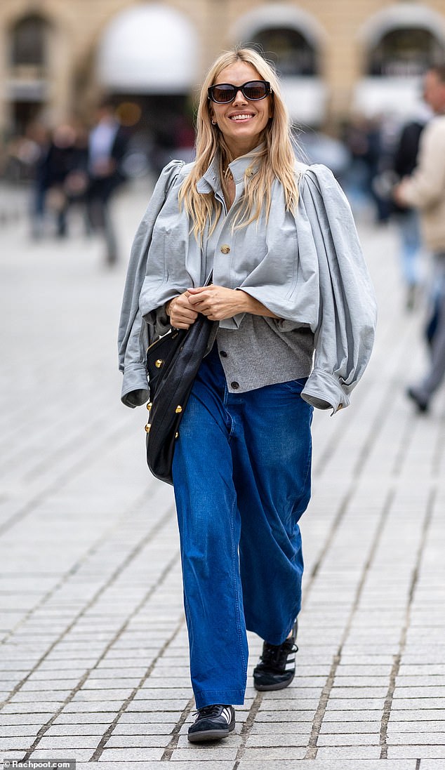 Sienna looked casually chic in a chic pale blue airy jacket which she wore over a simple white T-shirt.