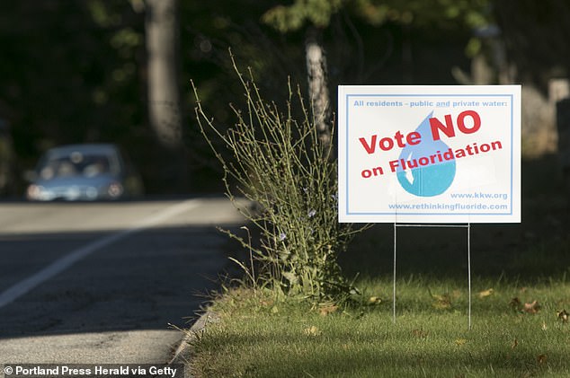 There has been controversy over fluoride in the water supply for years, with hundreds of communities voting against its use (above is a campaign sign from Kennebunk, Maine).