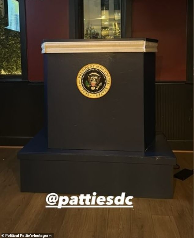 Political elements are woven throughout the space, including a second-floor DJ booth resembling the presidential lectern.