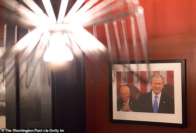 Framed portraits of presidents hang throughout the three-story bar.