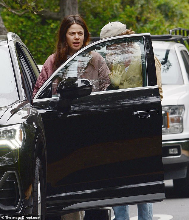 The actor was seen opening the car door for Molly.