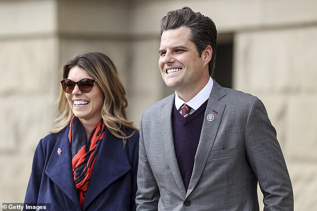 Gaetz walks with his fiancée Ginger Luckey before speaking to a crowd in 2021. The two are now married.