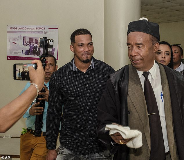 Franco (smiling) leaves court with his lawyer Teodosio Jáquez (right) in Puerto Plata last month.