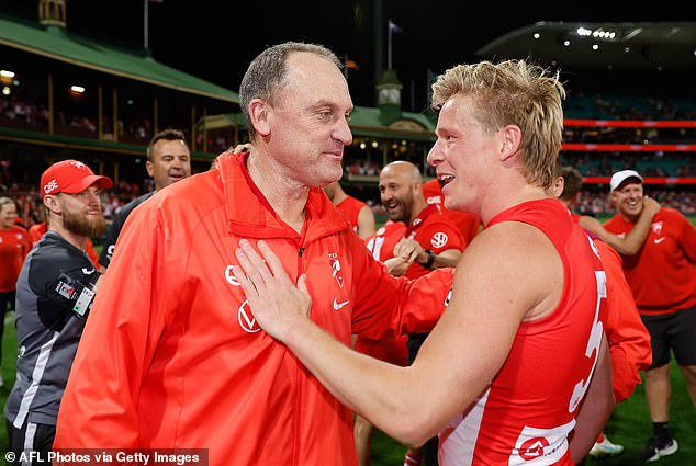 Other AFL fans believe long-time Sydney Swans coach John Longmire, pictured with star player Isaac Heeney, could call it a career.