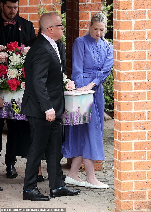 Charlotte's parents Mat and Kelly carried their daughter's coffin to the church (pictured)