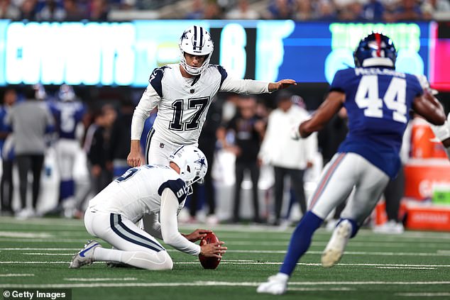 Brandon Aubrey #17 of the Dallas Cowboys kicks an extra point during the first quarter