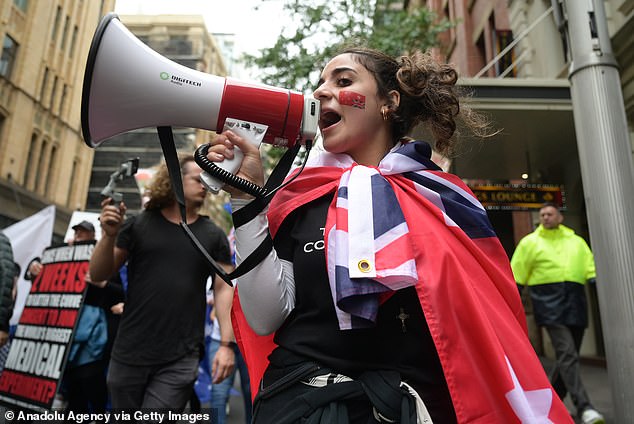 Human rights groups are concerned the proposed legislation could restrict freedom of expression (pictured by a protester in Sydney in November 2021)