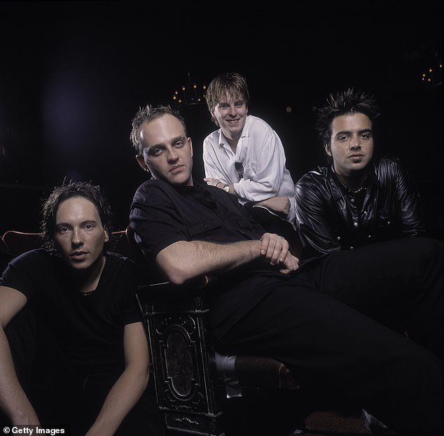 The singer, 50, has revealed the band will continue, in two forms, after becoming caught up in a bitter legal dispute with former bandmates. Pictured from left: Tim Wild, Tim Watson, Daniel Hall and Jason Singh