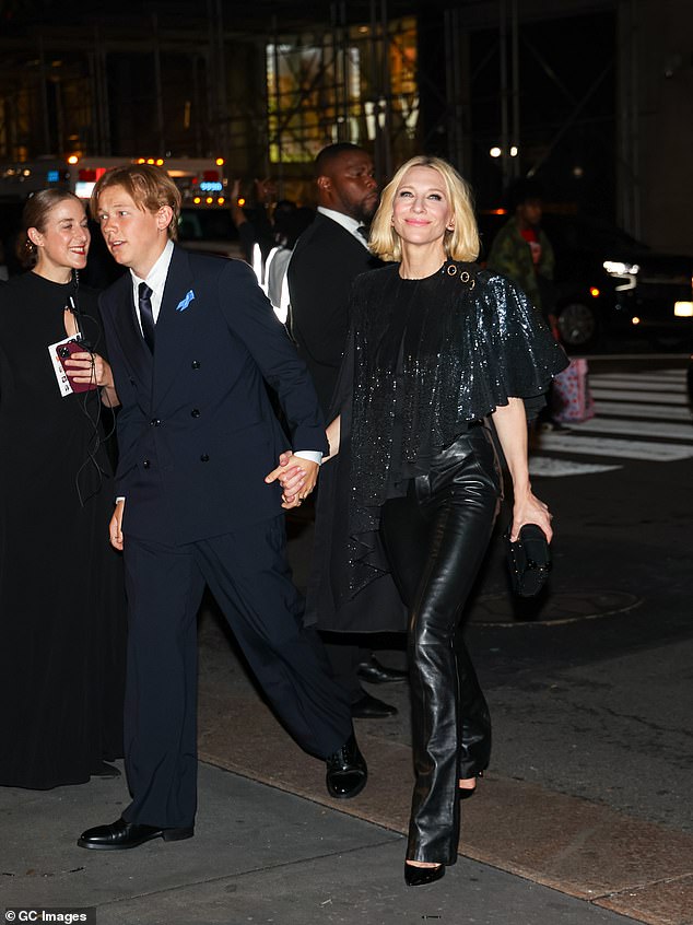 Dashiell also cut a dapper figure in a dark blue double-breasted suit which he paired with a pair of black leather pumps.