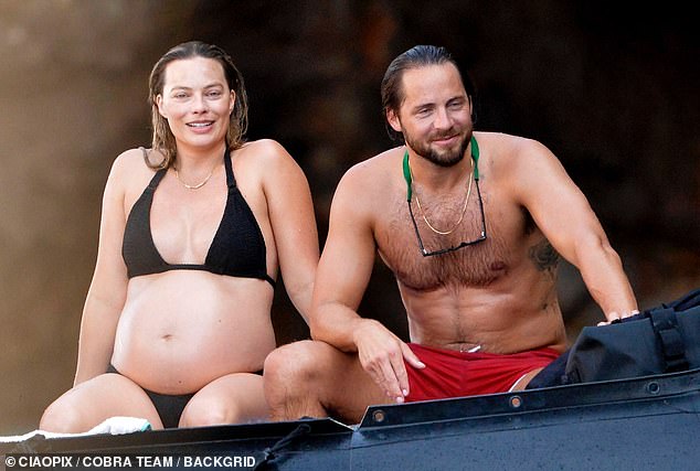 Barbie actress Margot is currently awaiting the arrival of her first child with husband Tom Ackerley, 34 (both pictured in August).