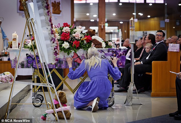 Charlotte's mother, Kelly, kissed her daughter's coffin during Friday's service.