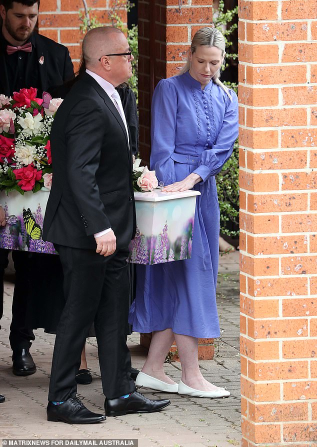 Charlotte's parents Mat and Kelly carried their daughter's coffin to the church (pictured)